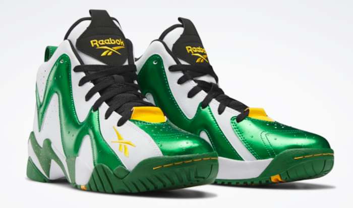 View of green and white Reebok shoes.